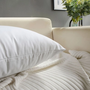 Detailed view of high-density white twill fabric pillow core with durable double stitching