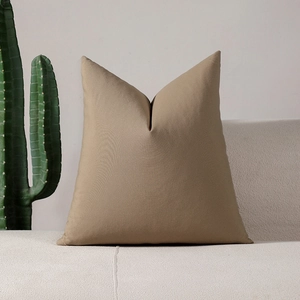 Minimalist khaki checkered cushion cover with a stylish butterfly ear design on a sofa