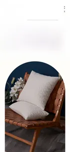 Detail of 3D jacquard leaf pattern on cream chenille pillow covers with texture