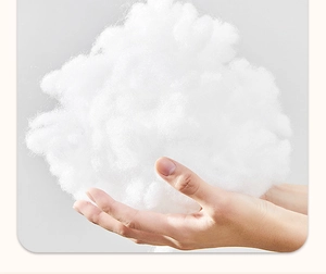 Close-up of white fluffy polyester filling showing soft texture and high resilience