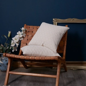 French cream chenille sofa cushion cover with 3D leaf pattern on a vintage wooden chair