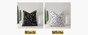 Detail view of plush square pillow covers featuring black and white spotted patterns