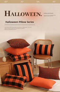 Close-up of mixed Halloween throw pillows with orange and black plaid textures on furniture