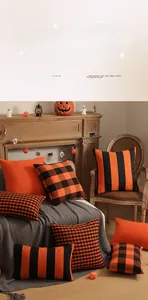 Cozy living room detail with Halloween pillows in orange and black check and stripe patterns