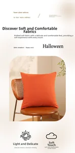 Detailed texture of orange knitted Halloween pillow on a wooden rattan chair