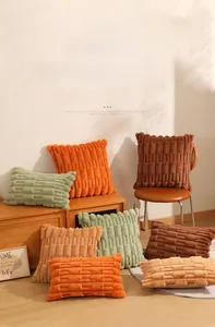 Detailed wheat spike texture on soft faux rabbit fur decorative cushion cover in warm tones