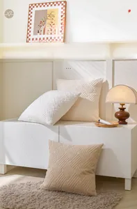 Detail of double-sided embossed geometric plush pillowcase with textured diagonal pattern