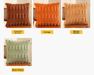 Detail of plush faux rabbit fur pillows in caramel brown, mocha, and green on a leather chair