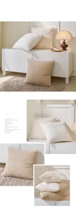 Close-up of embossed geometric plush pillowcase with textured velvet fabric and tassels