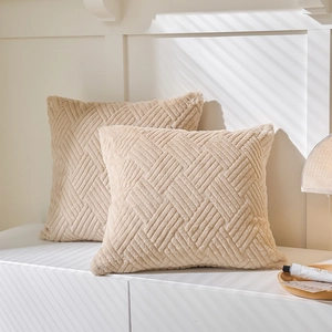 Pair of beige geometric embossed plush cushion covers with textured weave for sofa decor