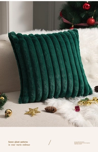Close-up of deep green faux fur pillowcase with textured vertical stripes for holiday decor