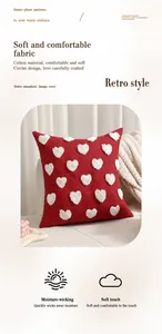 Gros plan sur les motifs de cœurs 3D tuftés sur tissu rouge en coton et polyester premium