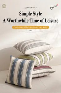 Detailed texture of striped linen cushion covers stacked on a sofa in a modern setting