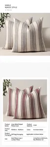 Close-up of wide striped linen cushion covers in grey and red with fabric textures