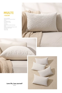 Detail of cream chenille cushion cover featuring 3D jacquard leaf texture and geometric weaving