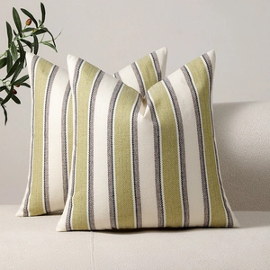 Linen striped cushion covers in green and grey on a beige sofa, set of two for home decor