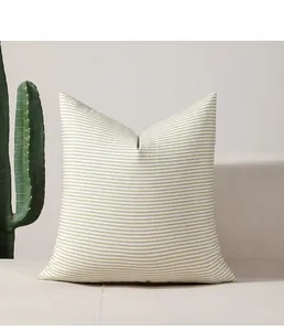 Detail of green striped Nordic style sofa pillow showcasing high-quality fabric texture