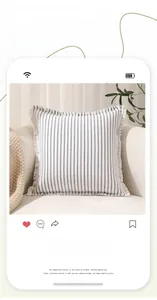 Detail of blue striped cotton cushion cover with decorative fringe on a soft sofa