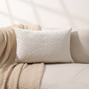 Cream jacquard chenille lumbar pillow cover with relief wave patterns on a sofa