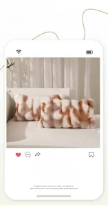 Detail of two plush faux rabbit fur pillow covers with brown tie-dye pattern on soft sofa