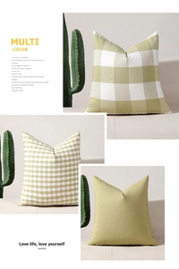 Detailed view of textured grass green plaid and solid cushion covers on a sofa
