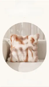 Close-up of fluffy faux fur square pillowcase with brown and white tie-dye pattern texture