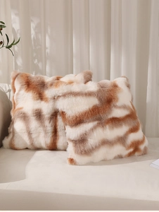 Detail of striped faux rabbit fur texture on luxury plush sofa pillow covers
