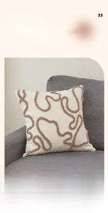 Detail of minimalist bouclé pillow cover with brown 3D wave tufted texture on sofa