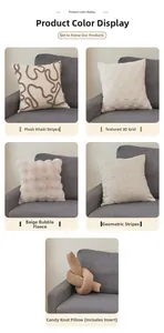 Detail of minimalist cream and brown textured lamb wool throw pillows on a grey sofa