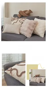 Macro detail of textured lamb wool and tufted fabric pillow covers in cream white