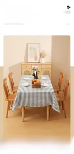 Detailed blue and white checkered waterproof tablecloth on a wooden table setup
