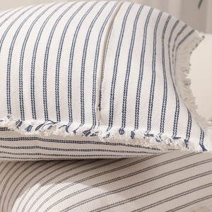 Modern blue striped cotton pillow cover with fringed edges and hidden zipper closure