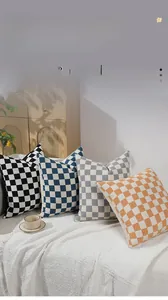Close-up of chenille checkerboard pillow cover texture in four distinct color variants