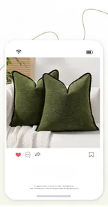 Detail of forest green chenille cushion covers with black wavy braided edge piping