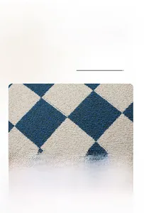 Close-up of blue and white checkered chenille fabric with soft loop texture