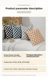 Chenille checkerboard cushions in black, grey, blue, and orange on a white sofa
