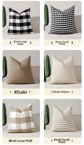 Détail de six housses de coussin géométriques de luxe en noir et kaki avec texture