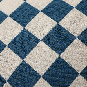 Minimalist navy and beige chenille checkerboard pillow cover with soft textured weave