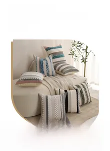 Close-up of tufted bohemian cushion covers featuring tassels and woven textures