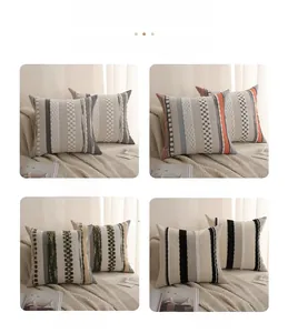 Close-up of tufted woven cushion covers with geometric patterns in four color variations