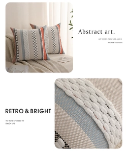Macro detail of bohemian tufted throw pillow case with blue and orange geometric texture