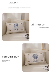 Detail of lumbar pillow cover with wood buttons and printed sea shell marine motifs