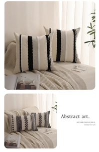 Close-up of tufted woven pillow cover with abstract stripes and textured fabric detail