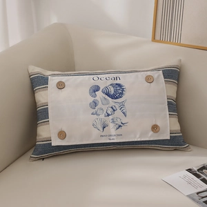 Blue striped lumbar pillow with ocean sea shell print and vintage wooden buttons