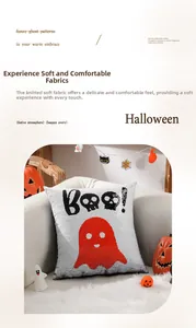 Close-up of Halloween sequin pillow with red ghost pattern and Boo text on white sofa