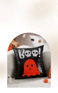 Detailed view of Halloween sequin pillow with spooky ghost design and Boo text on sofa