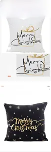 Detail of gold foil Merry Christmas text and snowflake patterns on black and white pillowcases