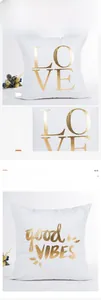 Detail of soft white cushion cover with premium golden LOVE and good VIBES foil printing