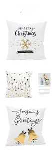 Detail of Christmas pillow covers featuring gold foil snowflakes and bells design