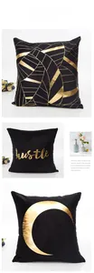 Detail of black velvet pillowcase featuring golden foil geometric and crescent designs